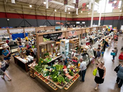 aerial shot of market vendors and shoppers 