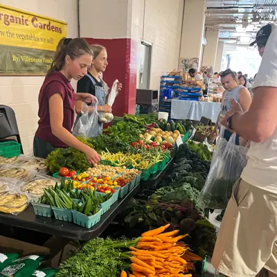 Vendor selling produce at the Kitchener Market 