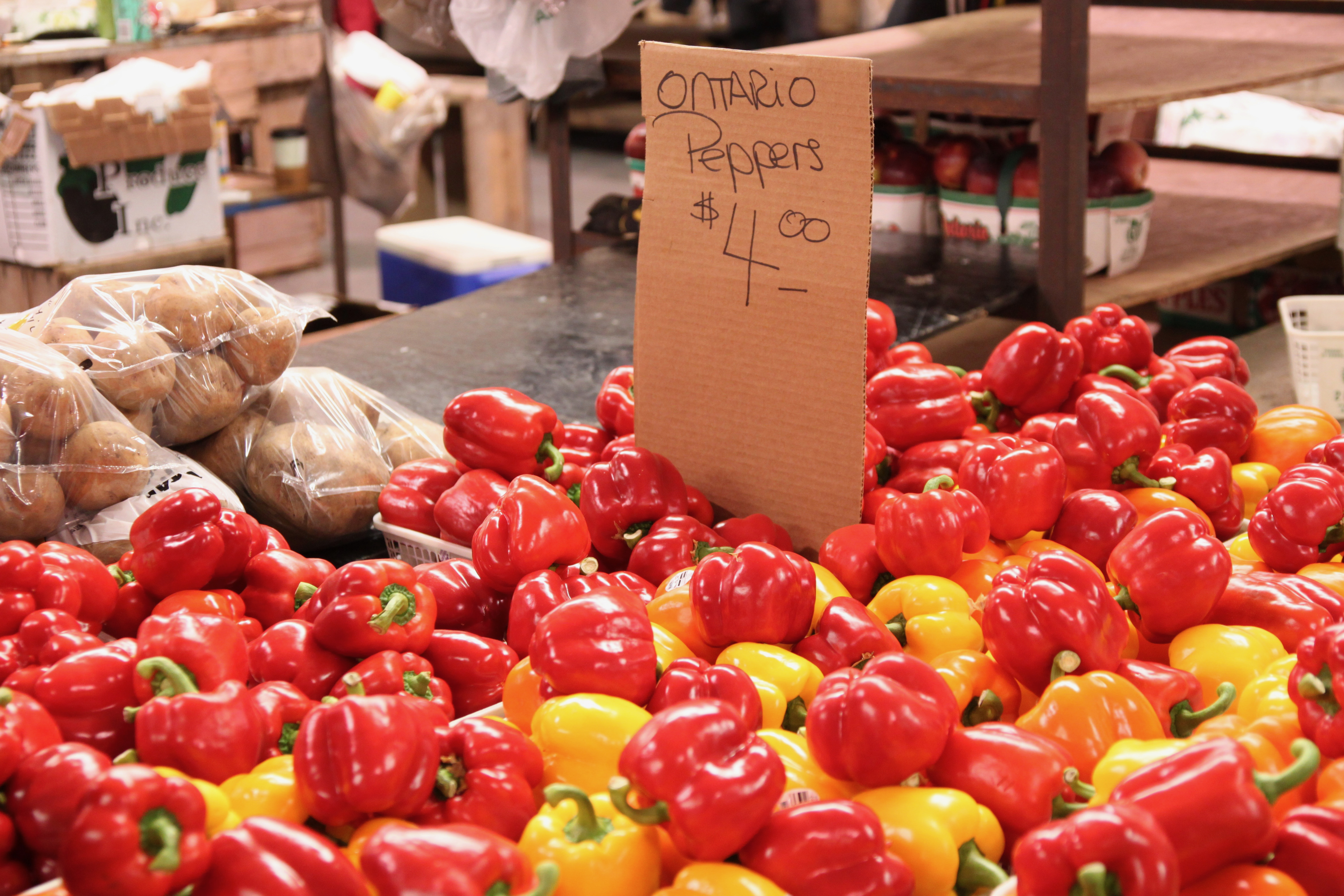 pile of bell peppers at a farmers market