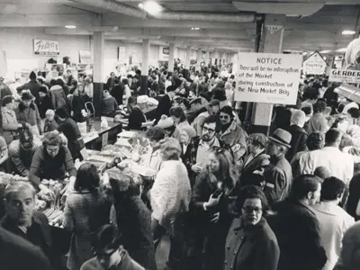 Black and white photo of a crowd at a farmers market